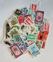 Worldwide Stamp accumulation, 1 oz around 450 off paper stamps .